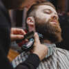 Barber cuts beard to a brutal guy