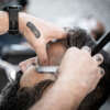 High angle view of a barber shaving a client in a barber shop